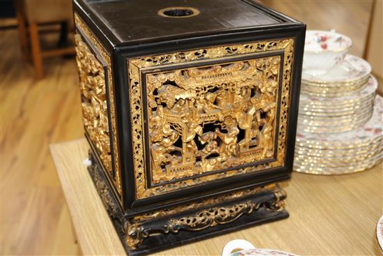 A late 19th/early 20th century Chinese giltwood and black lacquer incense stand